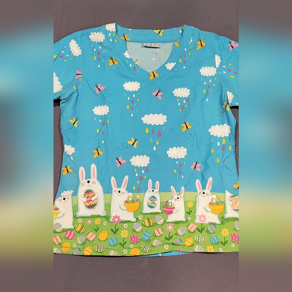 Adorable Easter scrub top. Gently used condition. Not sure though if L or XL.